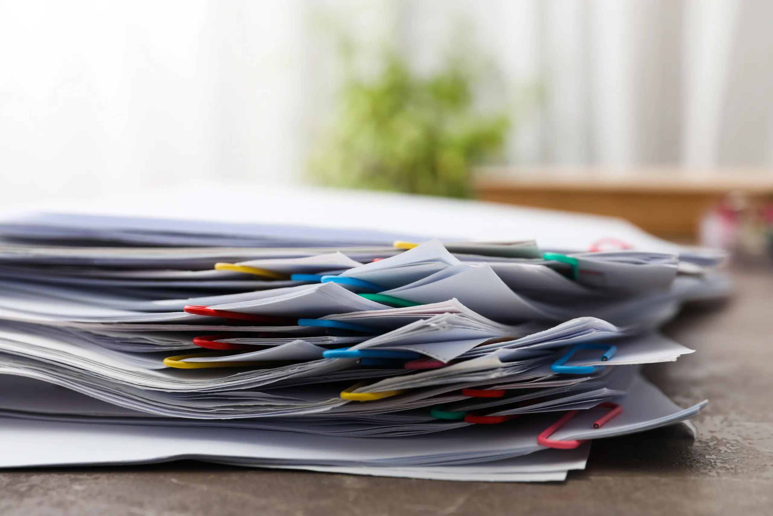 Concept of different office accessories – paper with clip